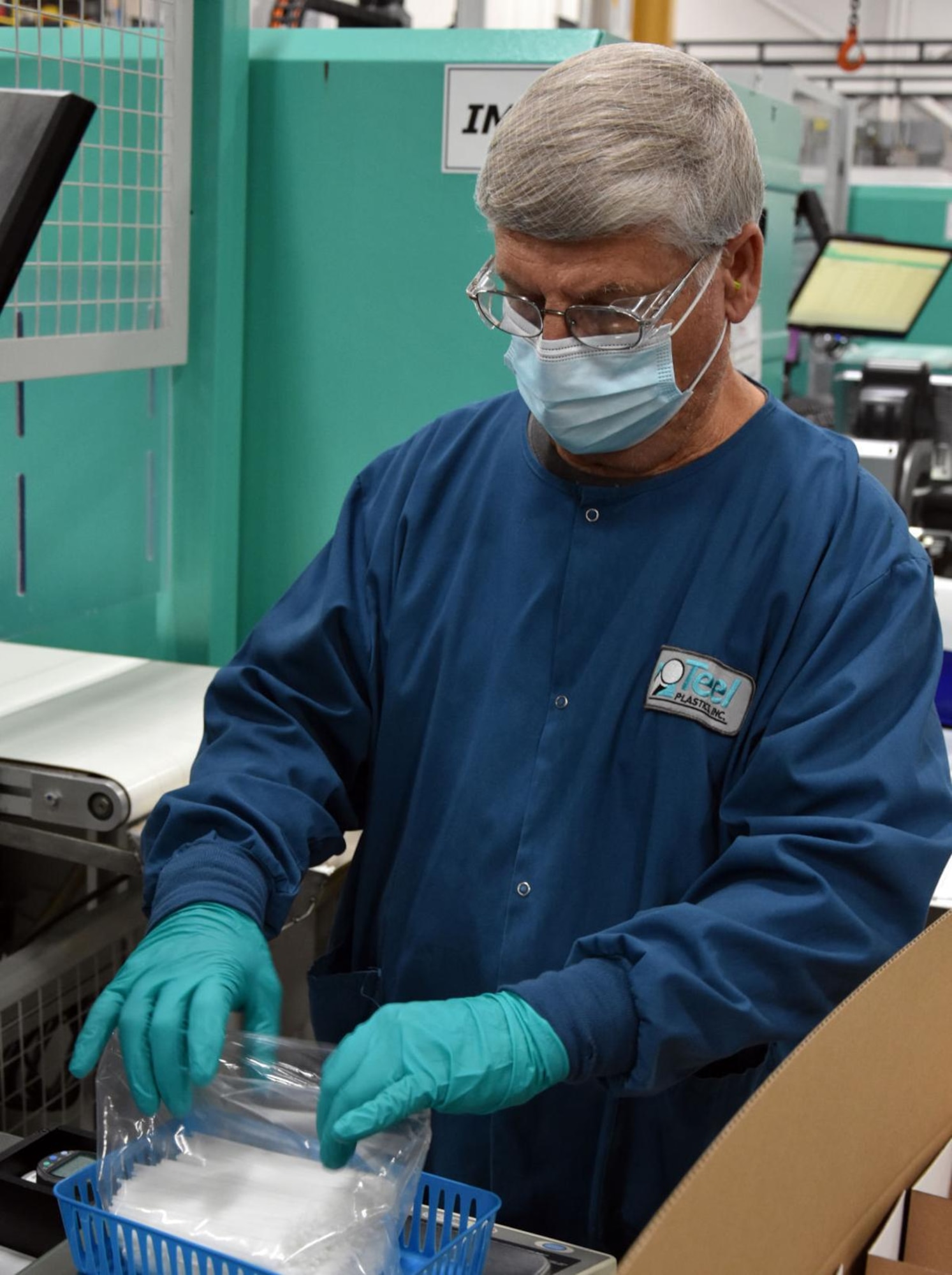 Teel Plastics employee Ken Popp arranges COVID-19 testing swabsticks at the manufacturing facility in Baraboo, Wisconsin. Members of the Strategic Warning and Surveillance Systems Division of the Digital Directorate awarded a $6.98 million firm-fixed-price contract to Teel in mid-October. (Photo by Teel Plastics)