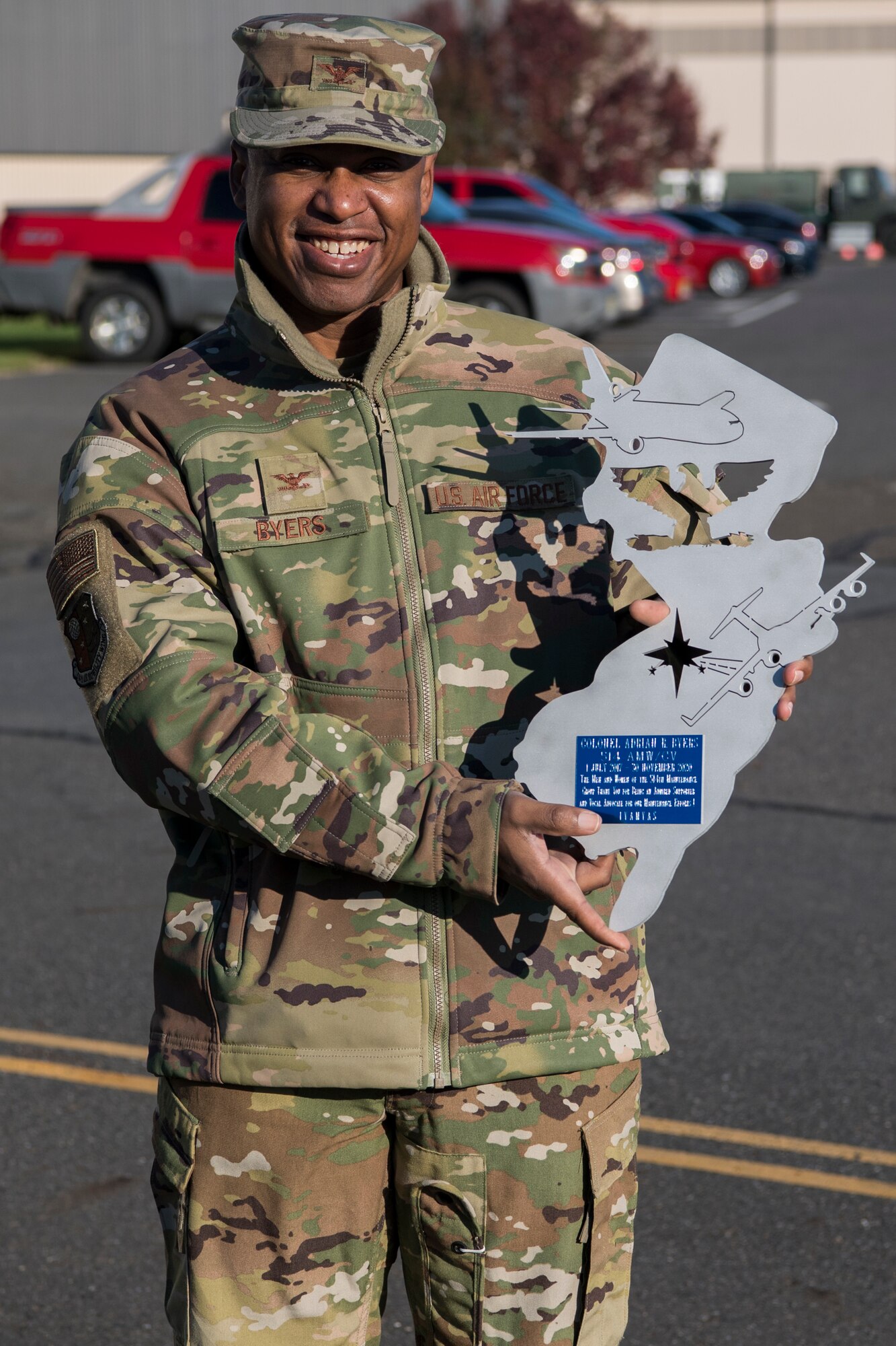 U.S. Air Force Reserve Col. Adrian R. Byers, vice commander of the 514th Air Mobility Wing, presents awards to members of the 514th Maintenance Group and 514th Civil Engineer Squadron on Joint Base McGuire-Dix-Lakehurst, N.J., Nov. 15, 2020. Byers also received a token of appreciation from the 514th MXG.