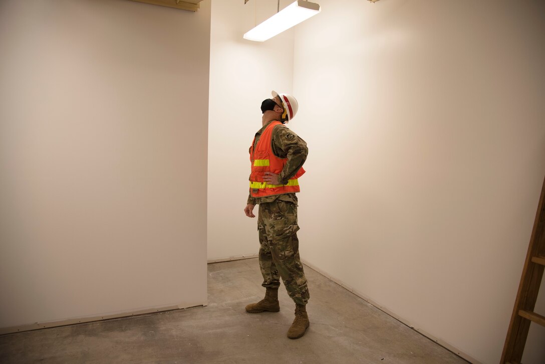 During the 2018 quake, walls inside the building fell and some exterior walls cracked running from the foundation to the roofline. In total, the damages cost about $4 million. The project was completed in October 2020. Shown here, Capt. Justin Dermond, USACE - Alaska District project engineer, inspects one of the repaired walls at the People Center.