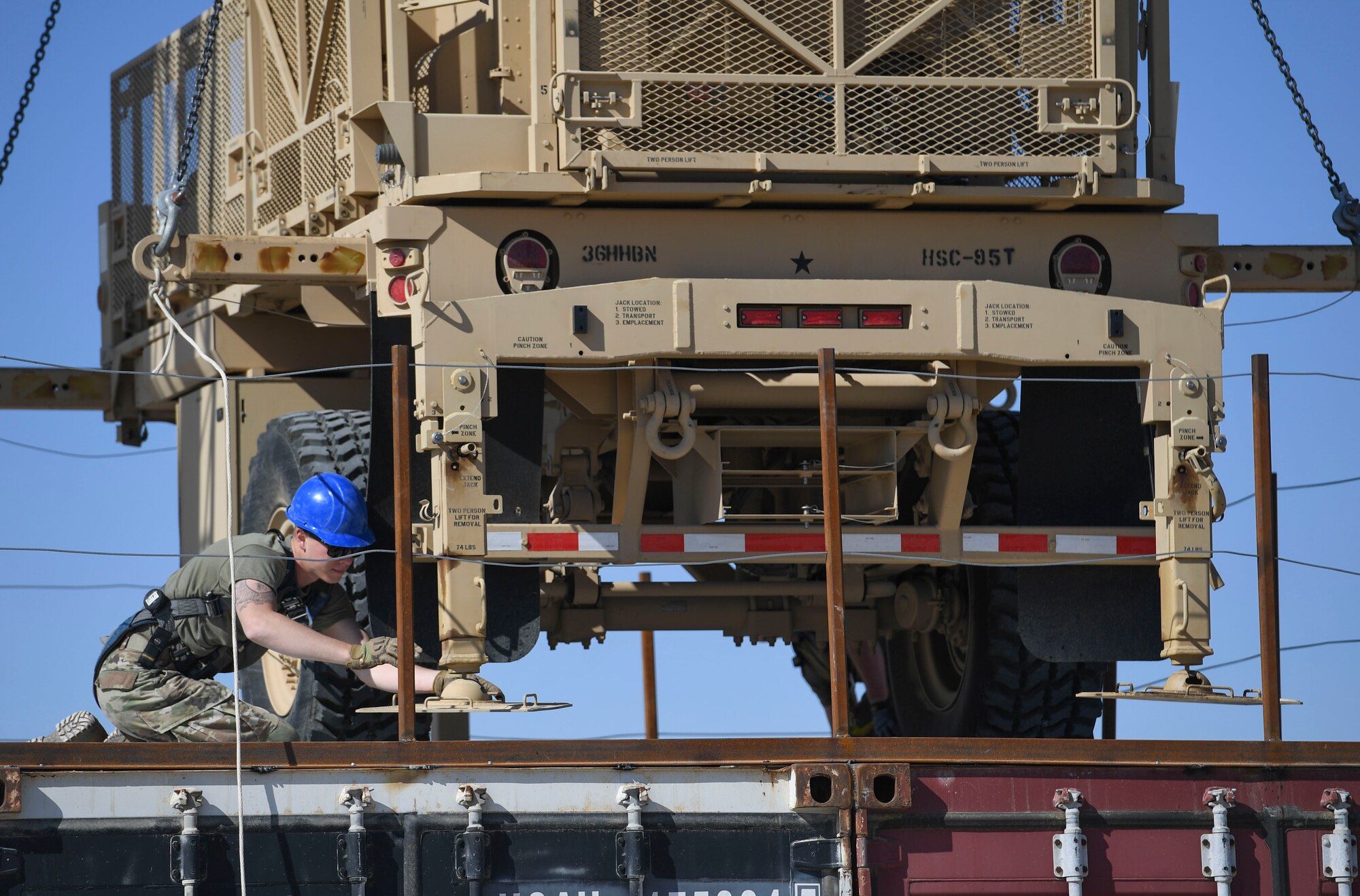 A U.S. Air Force Airman assigned to the 386th Expeditionary Civil Engineer Squadron structures unit stabilizes part of an AN/MQP-64 Sentinel radar at Ali Al Salem Air Base, Kuwait, Nov. 23, 2020.