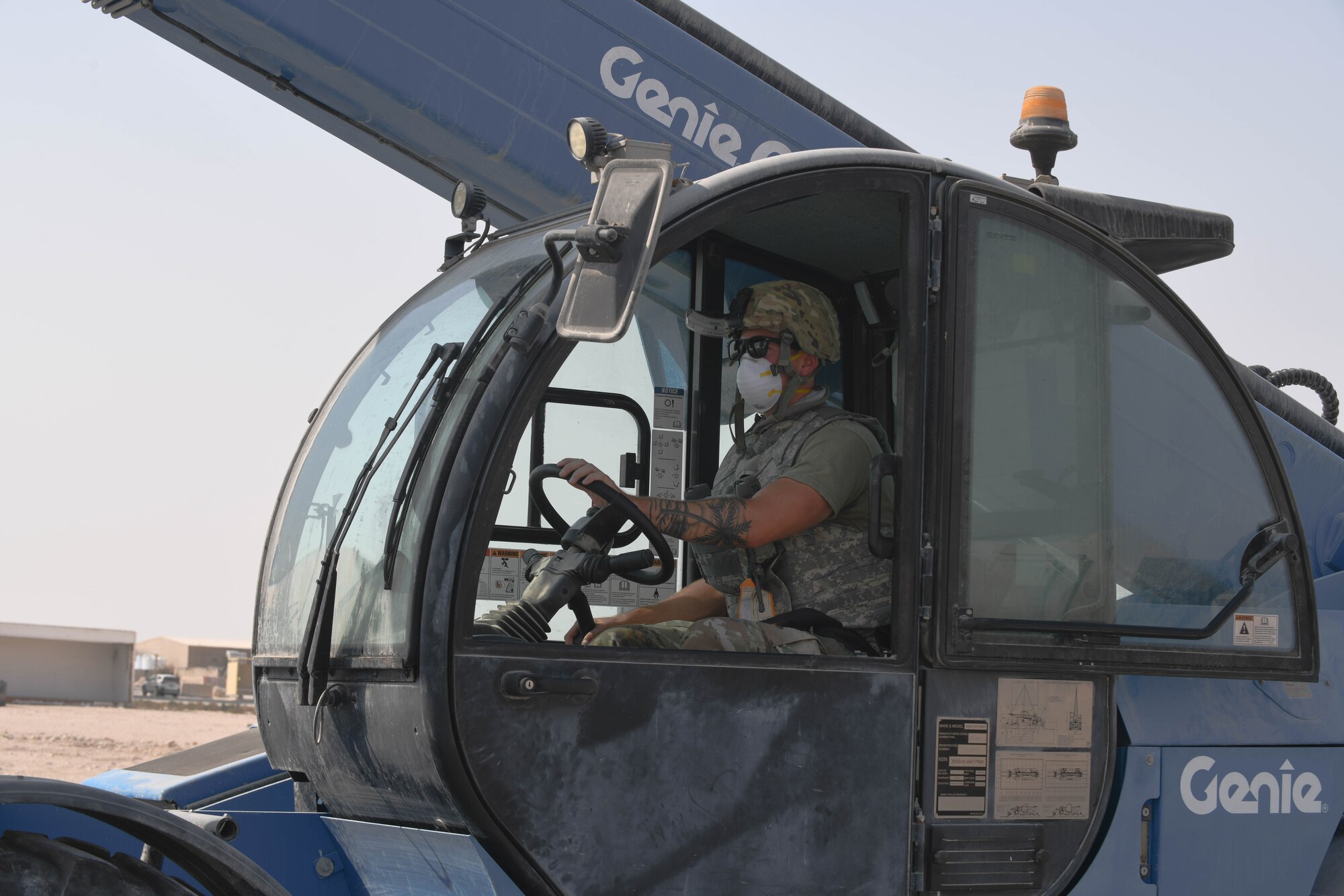 A U.S. Airman assigned to the 379th Expeditionary Civil Engineer Squadron operates a telescopic handler during a rapid airfield damage repair exercise at Al Udeid Air Base, Qatar, Nov. 18, 2020. 379th ECES Airmen used the vehicle to transport industrial-sized bags of concrete mix to repair craters in a mock airfield after a notional attack. The RADR training prepared the Airmen to efficiently and expeditiously restore a damaged airfield to operational status. (U.S. Air Force photo by Staff Sgt. Kayla White)