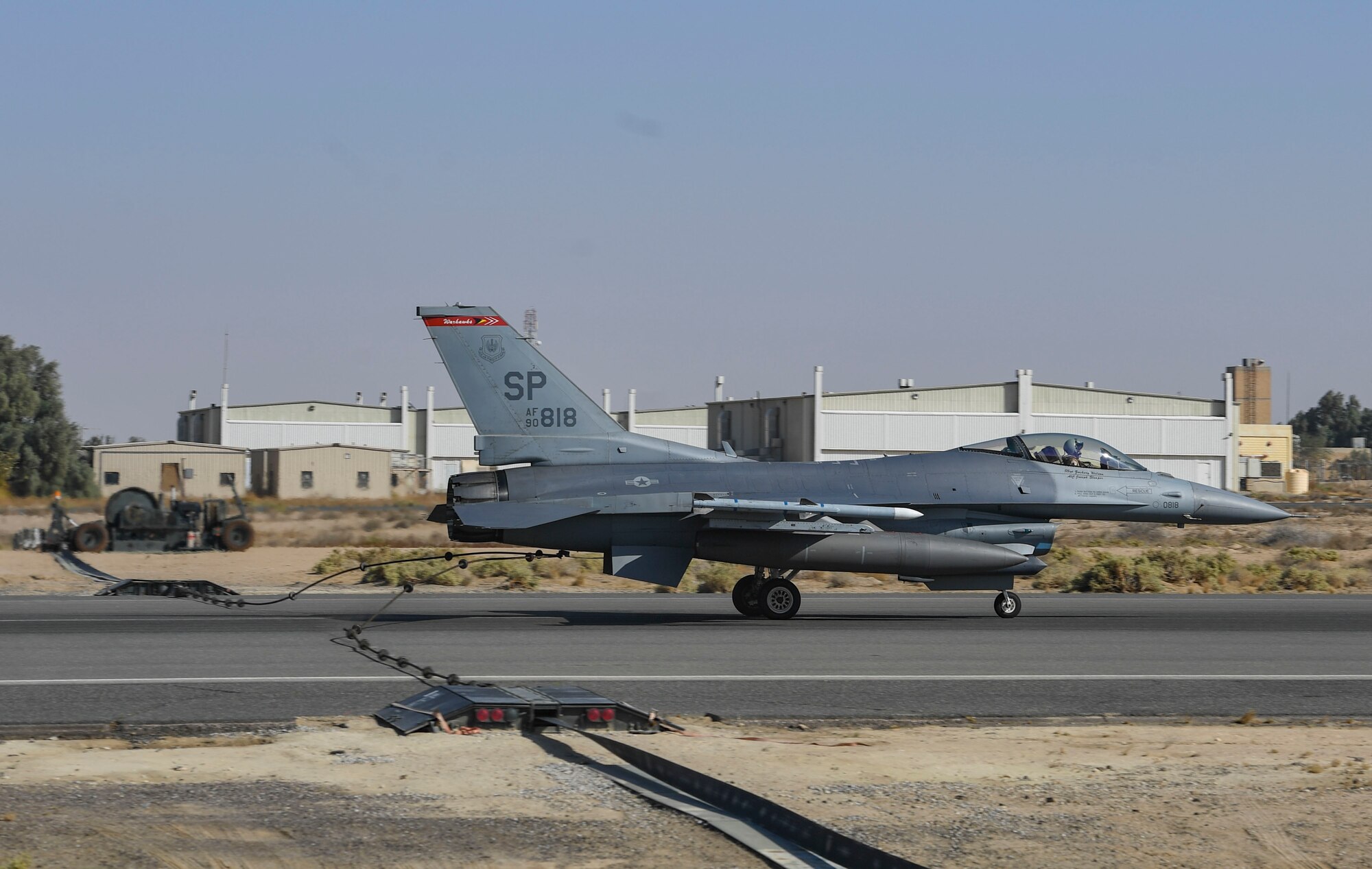 A U.S. Air Force F-16 Fighting Falcon assigned to the 480th Expeditionary Fighter Squadron attaches to a Mobile Aircraft Arresting System cable during a MAAS certification at Ali Al Salem Air Base, Kuwait, Nov. 22, 2020.