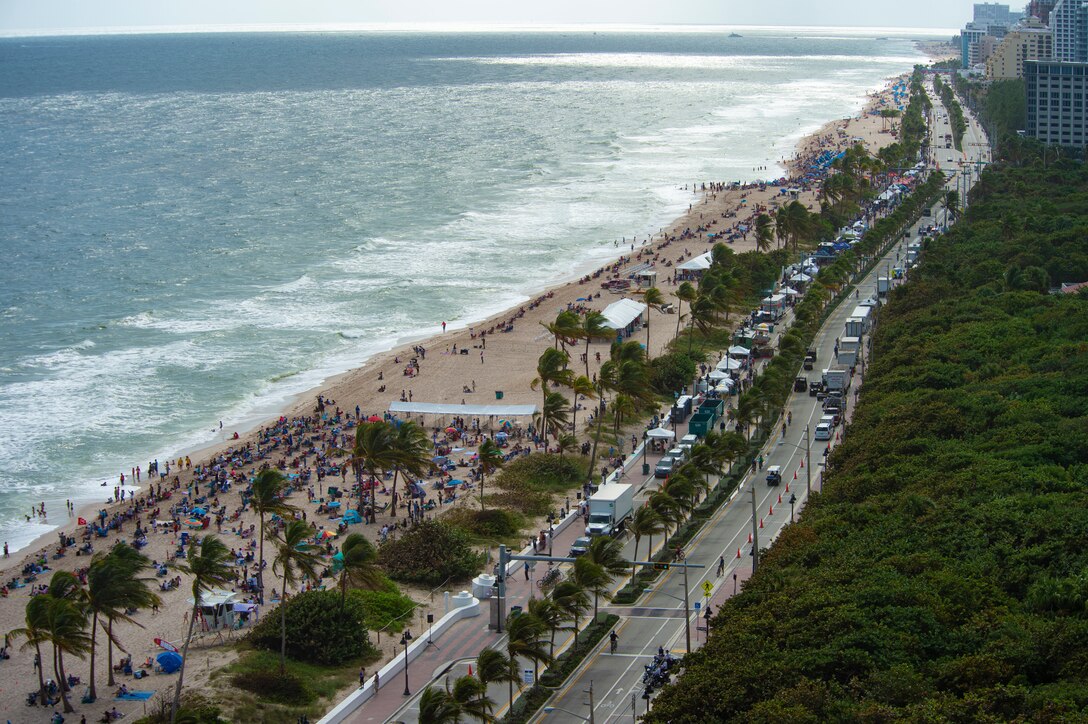 A crowd of spectators line Fort Lauderdale Beach, Florida, to watch aerial demonstrations from several U.S. Air Force demo teams and civilian acts during the 2020 Fort Lauderdale Air Show in Fort Lauderdale, Fla., Nov. 22, 2020. The C-17 West Coast Demo Team from Joint Base Lewis-McChord, Wash., participated in the two-day event to showcase the C-17’s airlift capabilities. (U.S Air Force photo by Senior Airman Tryphena Mayhugh)