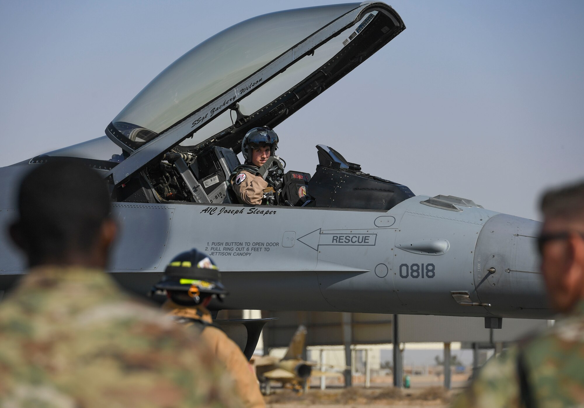 A U.S. Air Force F-16 Fighting Falcon pilot assigned the 480th Expeditionary Fighter Squadron awaits 386th Expeditionary Civil Engineer Squadron firefighter assessments during a Mobile Aircraft Arresting System certification at Ali Al Salem Air Base, Kuwait, Nov. 22, 2020.
