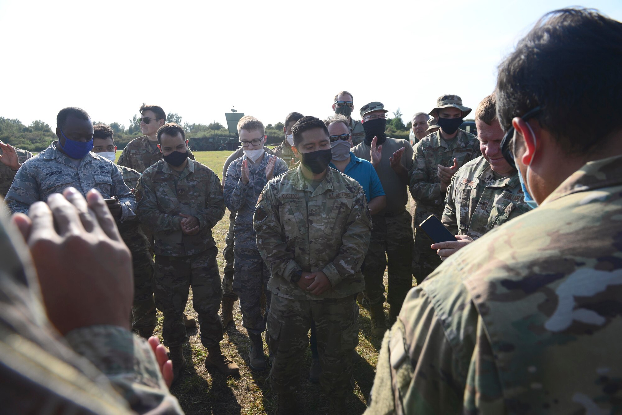 Senior Airman Joshua Olortegui, 606th Air Control Squadron theater deployable communications technician, learns he has been selected for promotion to the rank of staff sergeant at Malbork Air Base, Poland, Sept. 23, 2020. Two other 606th ACS airmen were given the same news while in the field during exercise Astral Knight 20. (U.S. Air Force photo by Tech. Sgt. Tory Cusimano)