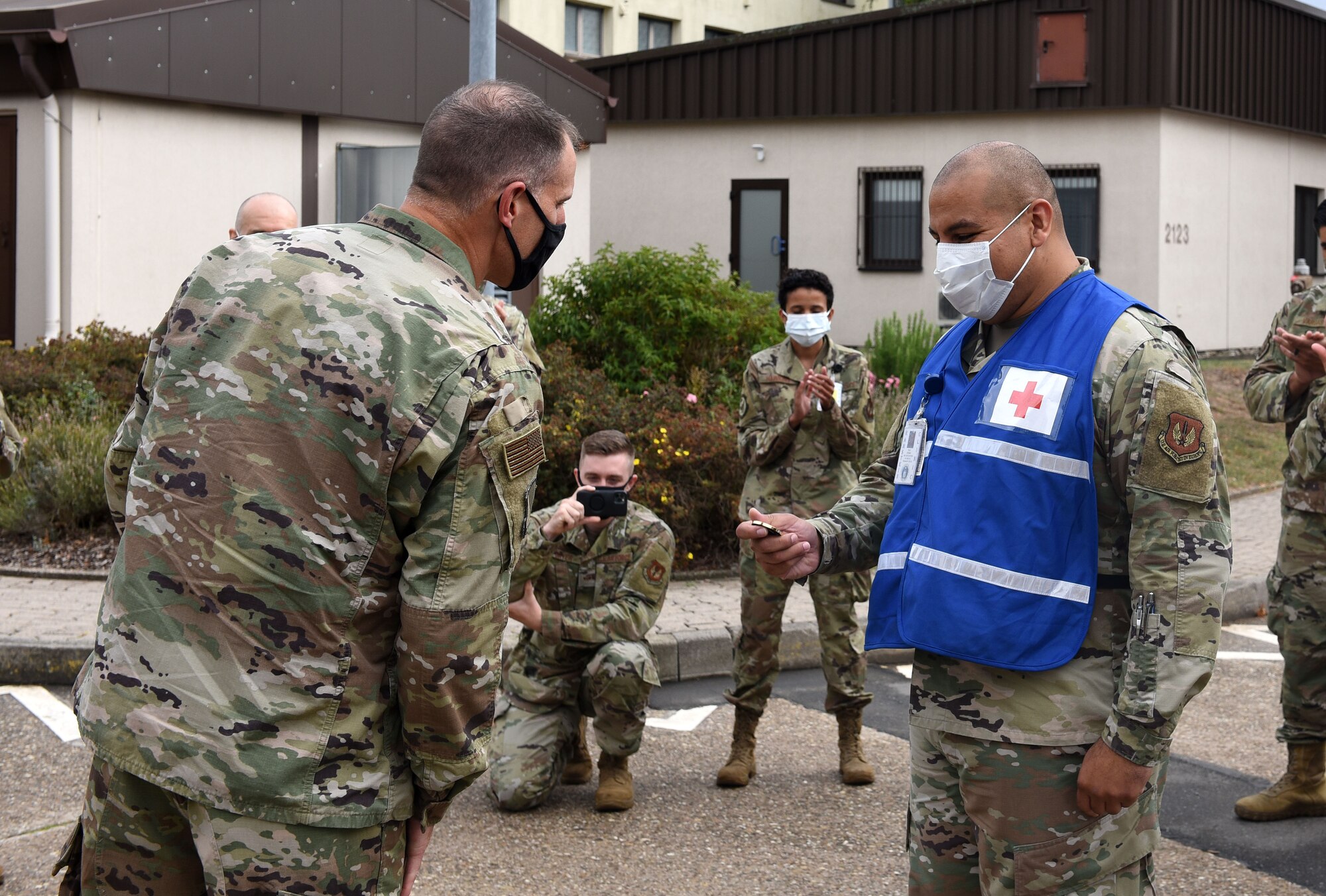 An award winner examines his new challenge coin
