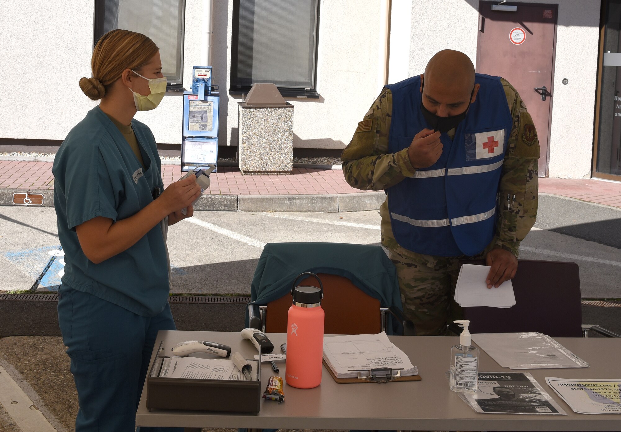 Two individuals inspecting paperwork.