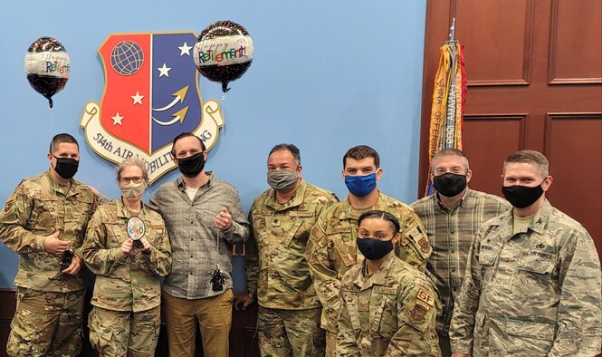 Lt. Col. Kimberly Lalley, Chief of Public Affairs at the 514th Air Mobility Wing, celebrates her retirement after 30 years and 4 months of military service--24 years at the California and New Mexico Air National Guard; and 6 years and 4 months at the 514th-- at Joint Base McGuire-Dix-Lakehurst, N.J., on September 30, 2020