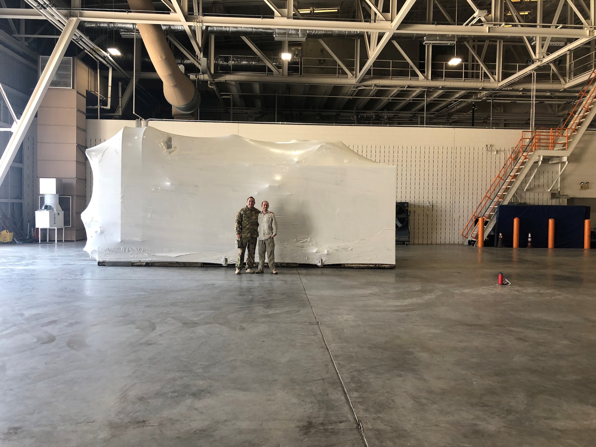 Maj. Eric Chase (right) and Chief Master Sgt. Ismael Paez (left), both functional program managers, played key roles in the effort to move the hypobaric altitude chamber to Joint Base San Antonio-Lackland, Texas. (Courtesy photo).