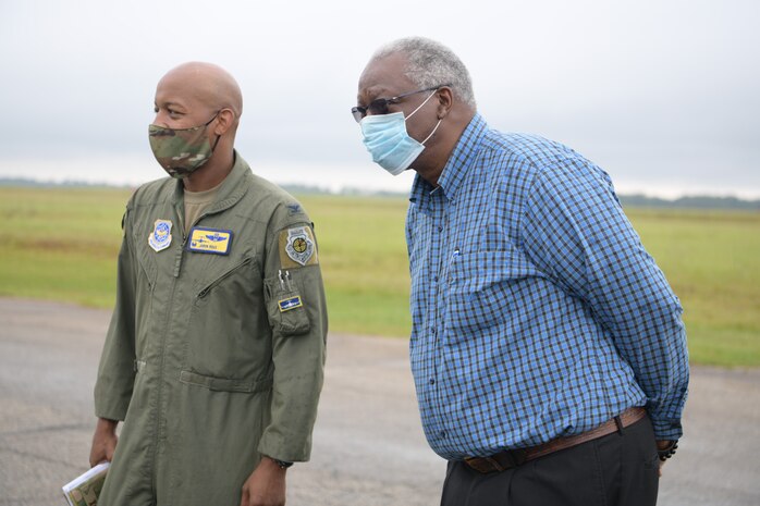 Col. Jaron Roux, 437th Airlift Wing commander, left, and Mayor Julius Jones, mayor of North S.C., right, stand on the runway of North Auxiliary Airfield Sept. 28, 2020, in North, S.C. While visiting NAAF, Joint Base Charleston leadership toured the infrastructure and facilities of the 2,400 acre airfield on the outskirts of a town with a population of less than 1,000 people and discussed the strategic advantage the training ground plays for Joint Base Charleston, Air Mobility Command, the DoD and other mission partners. (U.S. Air Force photo by Senior Airman Joshua R. Maund)