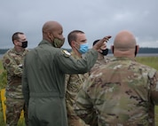Col. Jaron Roux, 437th Airlift Wing commander, left, points at a runway for Col. Marc Greene, Joint Base Charleston Commander, at North Auxiliary Airfield in North, S.C., Sept. 28, 2020. While visiting NAAF, Joint Base Charleston leadership toured the infrastructure and facilities of the 2,400 acre airfield on the outskirts of a town with a population of less than 1,000 people and discussed the strategic advantage the training ground plays for Joint Base Charleston, Air Mobility Command, the DoD and other mission partners. (U.S. Air Force photo by Senior Airman Joshua R. Maund)