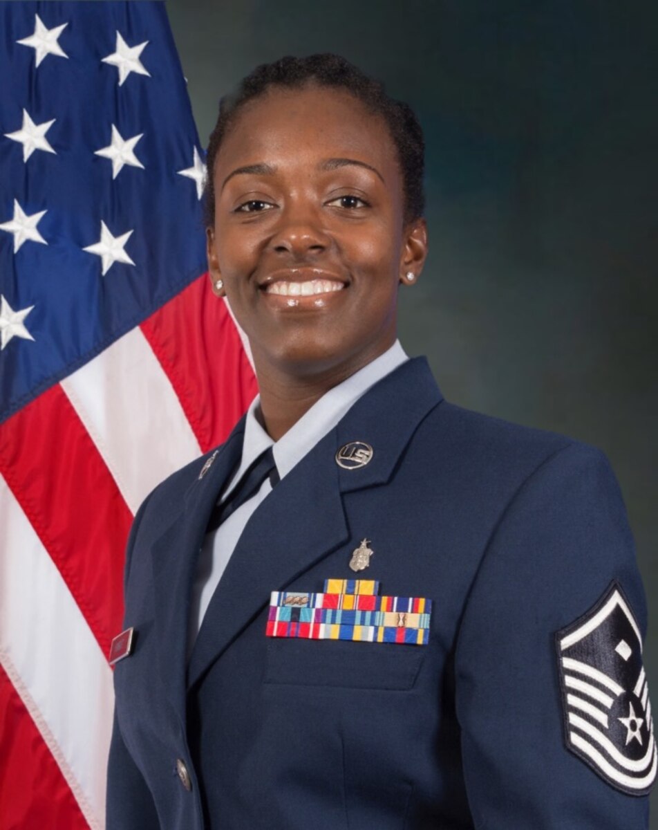 Master Sgt. Krystal Q. Knight smiles for an official photo.