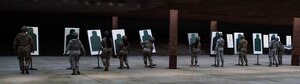Members of the 633rd Security Forces Squadron adjust their targets during M18 qualification testing at Joint Base Langley-Eustis, Virginia, Sept. 24, 2020.
