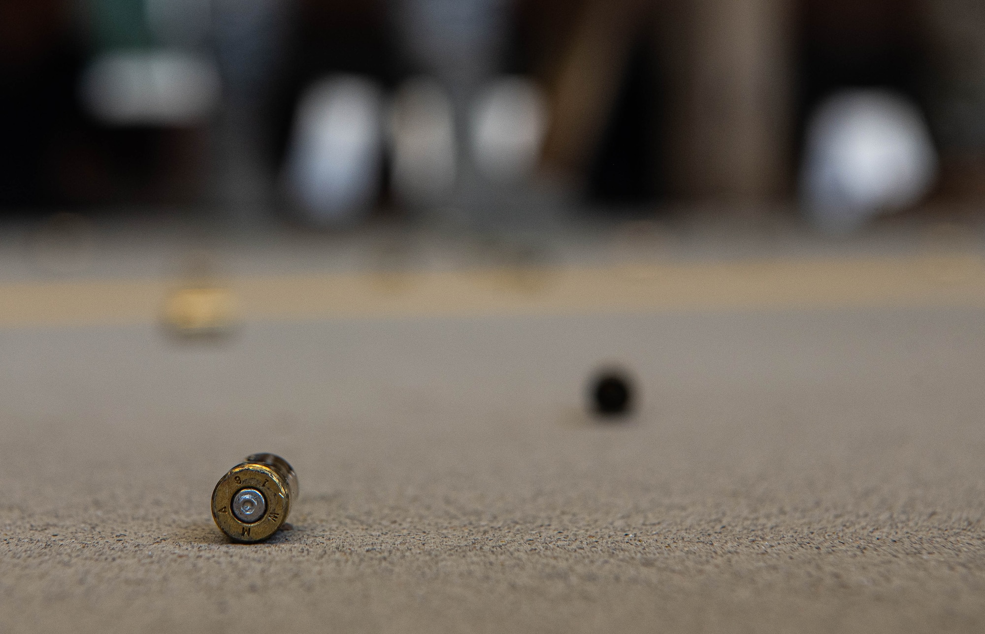 Spent ammunition lies on the ground during M18 qualification testing at Joint Base Langley-Eustis, Virginia, Sept. 24, 2020.
