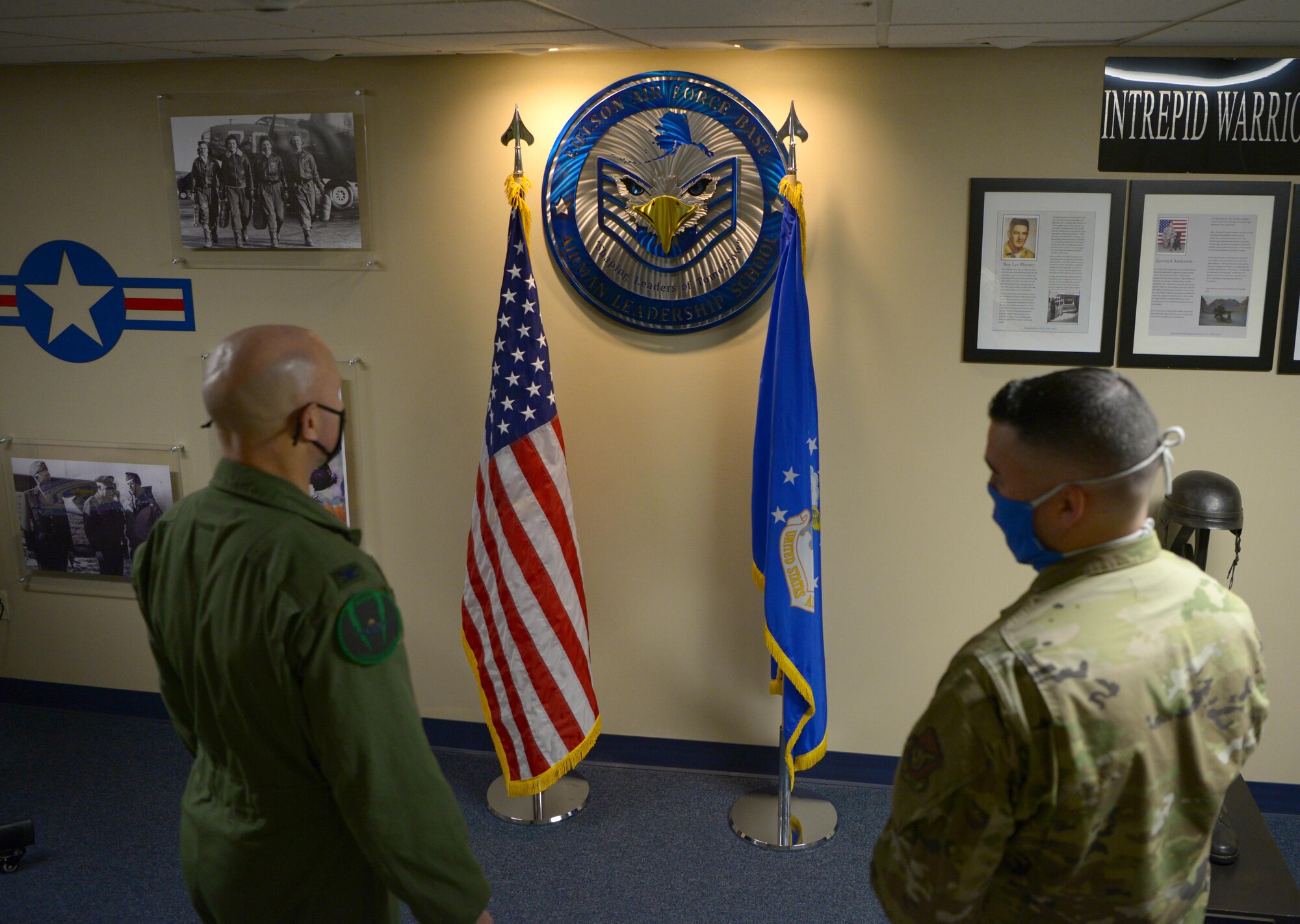U.S. Air Force Col. David Berkland, the 354th Fighter Wing commander, talks with Master Sgt. Christopher Brown, 354th Force Support Squadron Airman Leadership School (ALS) commandant, about ALS memorabilia on Eielson Air Force Base, Alaska, Sept. 29, 2020. Airman Leadership School is the first step in the Enlisted Professional Military Education continuum and prepares senior Airmen to be frontline supervisors. (U.S. Air Force photo by Senior Airman Beaux Hebert)
