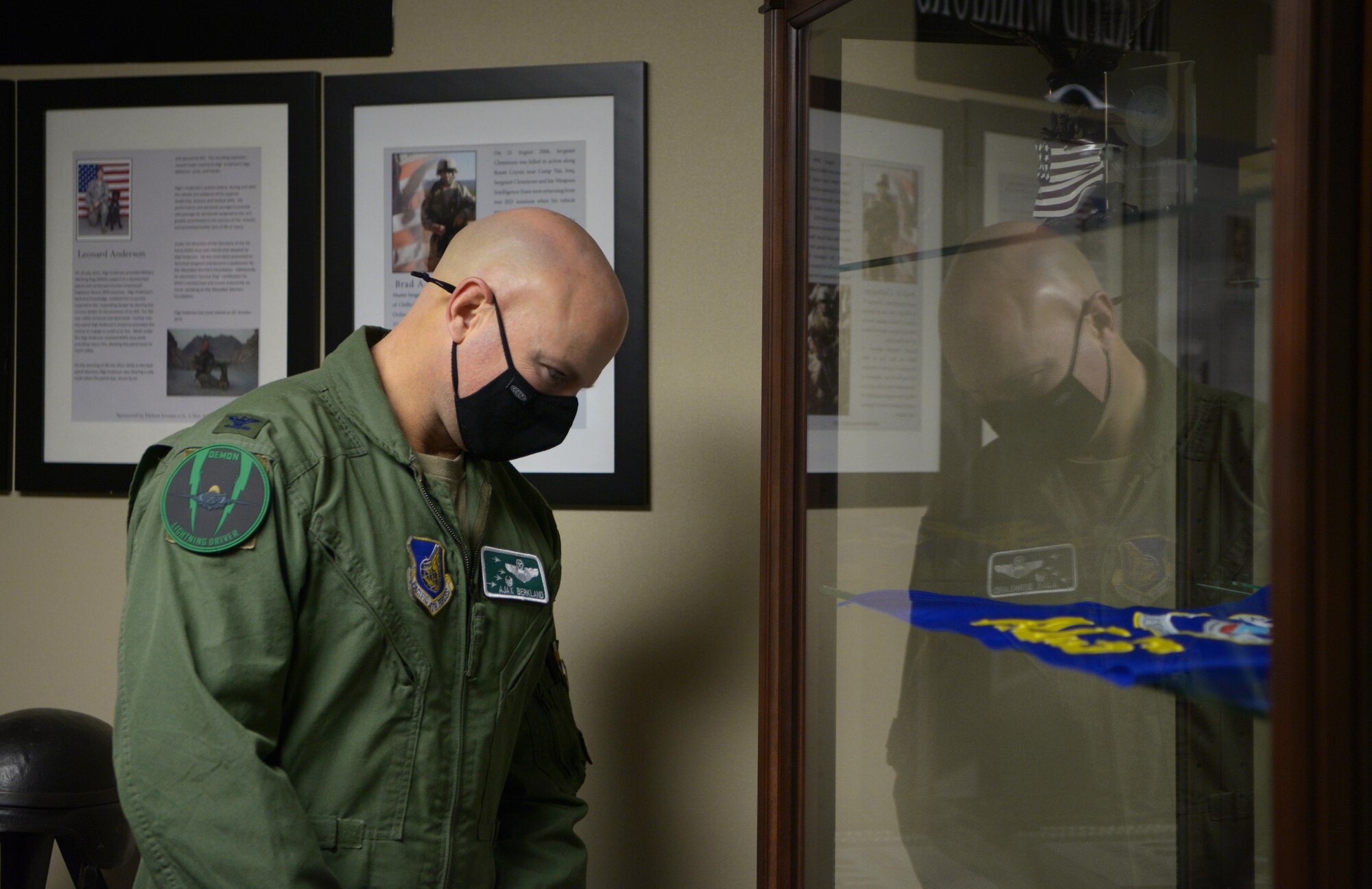 U.S. Air Force Col. David Berkland, the 354th Fighter Wing commander, observes Airman Leadership School (ALS) memorabilia on Eielson Air Force Base, Alaska, Sept. 29, 2020. The ALS facility is full of Air Force enlisted heritage items acquired and gifted by Airmen who have attended the course. (U.S. Air Force photo by Senior Airman Beaux Hebert)