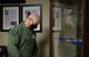U.S. Air Force Col. David Berkland, the 354th Fighter Wing commander, observes Airman Leadership School (ALS) memorabilia on Eielson Air Force Base, Alaska, Sept. 29, 2020. The ALS facility is full of Air Force enlisted heritage items acquired and gifted by Airmen who have attended the course. (U.S. Air Force photo by Senior Airman Beaux Hebert)