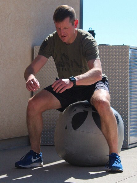Jeffrey Lucy, U.S. Space Command Joint Intelligence and Security, performs a squat Sept. 25, 2020, during the second annual dry triathlon at Schriever Air Force Base, Colorado. Lucy finished second overall in the event with a time of 38 minutes, 17 seconds. (U.S. Air Force photo by Marcus Hill)
