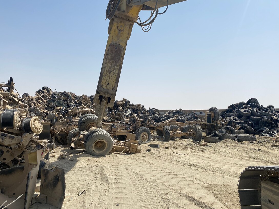 Operators use special equipment to break up larger pieces of scrap material.