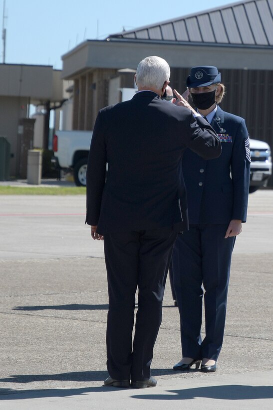 Maj. Gen. John Healy, 22nd Air Force commander, salutes Vice President Mike Pence on the flightline at Dobbins Air Reserve Base, Ga., Sept. 30, 2020. The vice president was also welcomed by Chief Master Sgt. Vicki Robertson, 94th Airlift Wing command chief, as well as other distinguished visitors. (U.S. Air Force photo/Senior Airman Justin Clayvon)