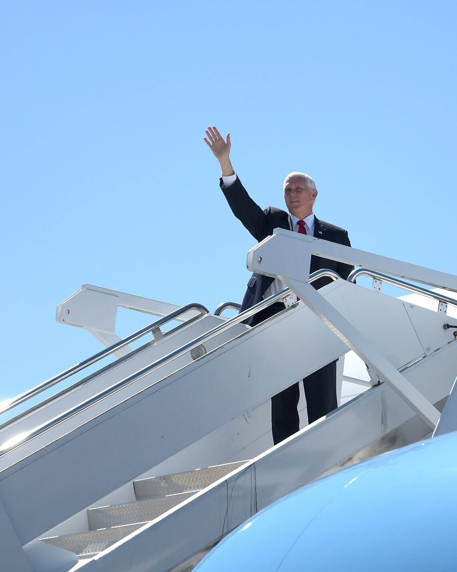 Vice President Mike Pence waves to onlookers at Dobbins Air Reserve Base, Ga. shortly after arriving on Air Force Two, Sept. 30, 2020. The vice president was greeted by senior leaders at Dobbins, including Maj. Gen. John Healy, 22nd Air Force commander, and Chief Master Sgt. Vicki Robertson, 94th Airlift Wing command chief, as well as other distinguished visitors.