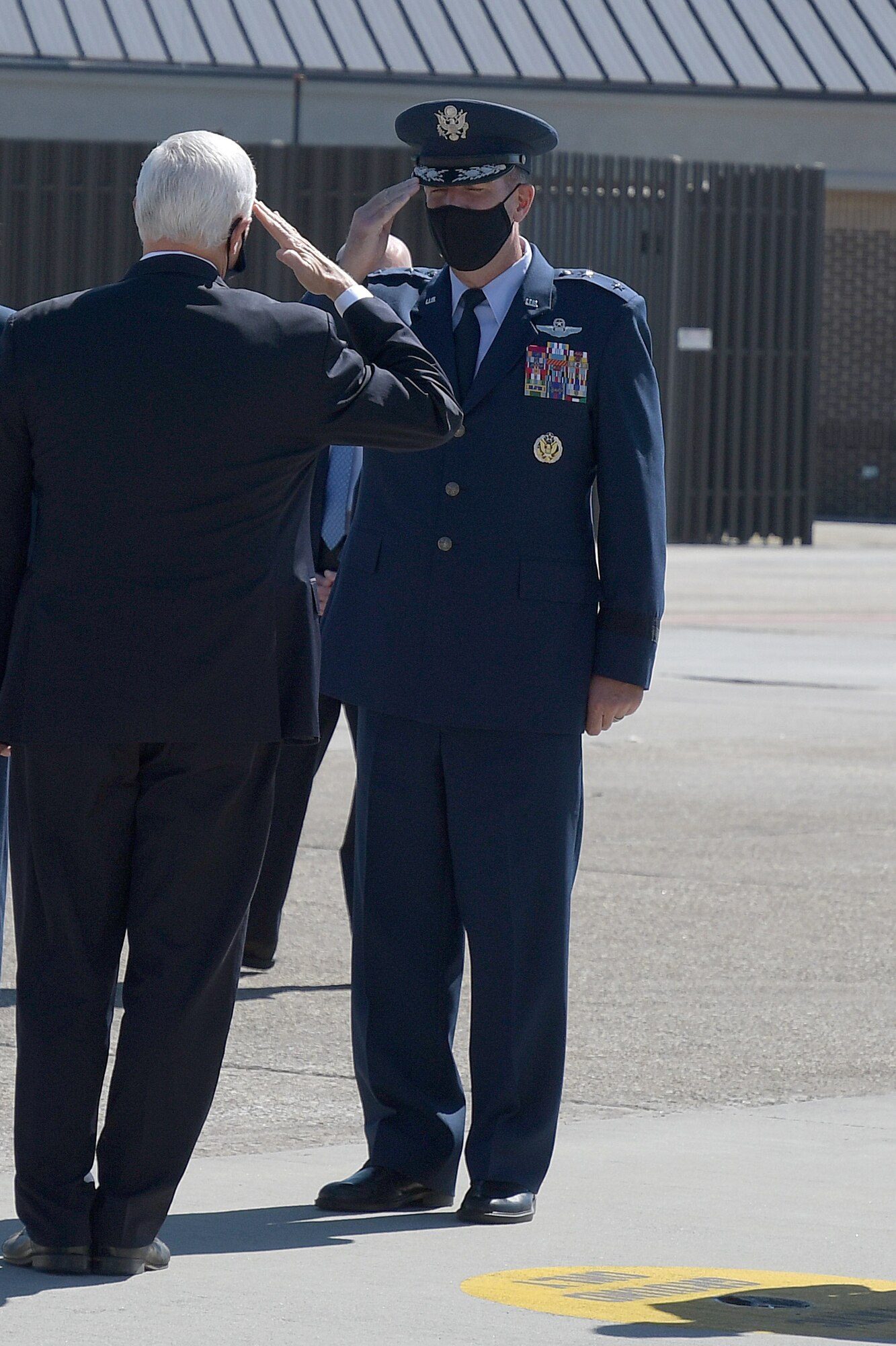 Maj. Gen. John Healy, 22nd Air Force commander, salutes Vice President Mike Pence on the flightline at Dobbins Air Reserve Base, Ga., Sept. 30, 2020. The vice president was also greeted by Chief Master Sgt. Vicki Robertson, 94th Airlift Wing command chief; Georgia Gov. Brian Kemp, and other distinguished visitors (U.S. Air Force photo/Senior Airman Justin Clayvon)