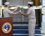 Cmdr. Nicholas Gamiz (left), commanding officer of Navy Talent Acquisition Group San Antonio, and executive officer Cmdr. Michael Files cut the ceremonial ribbon which decommissioned Navy Recruiting District San Antonio and established NTAG San Antonio at NTAG headquarters.