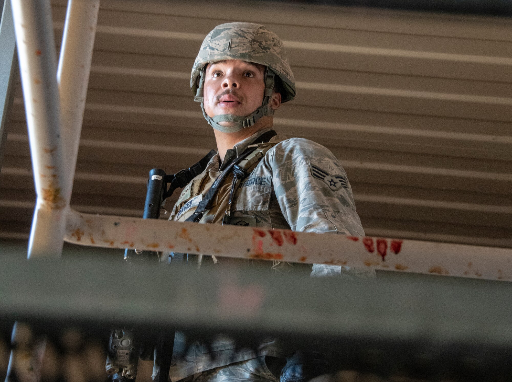 U.S. Air Force Senior Airman Jordan Reaves, 60th Security Forces Squadron installation patrolman, searches a facility for threats during a base exercise Sept. 24, 2020, at Travis Air Force Base, California. The exercise was designed to evaluate the training, readiness and capability of Travis first responders in order to effectively respond to active shooter threats to the installation. (U.S. Air Force photo by Heide Couch)
