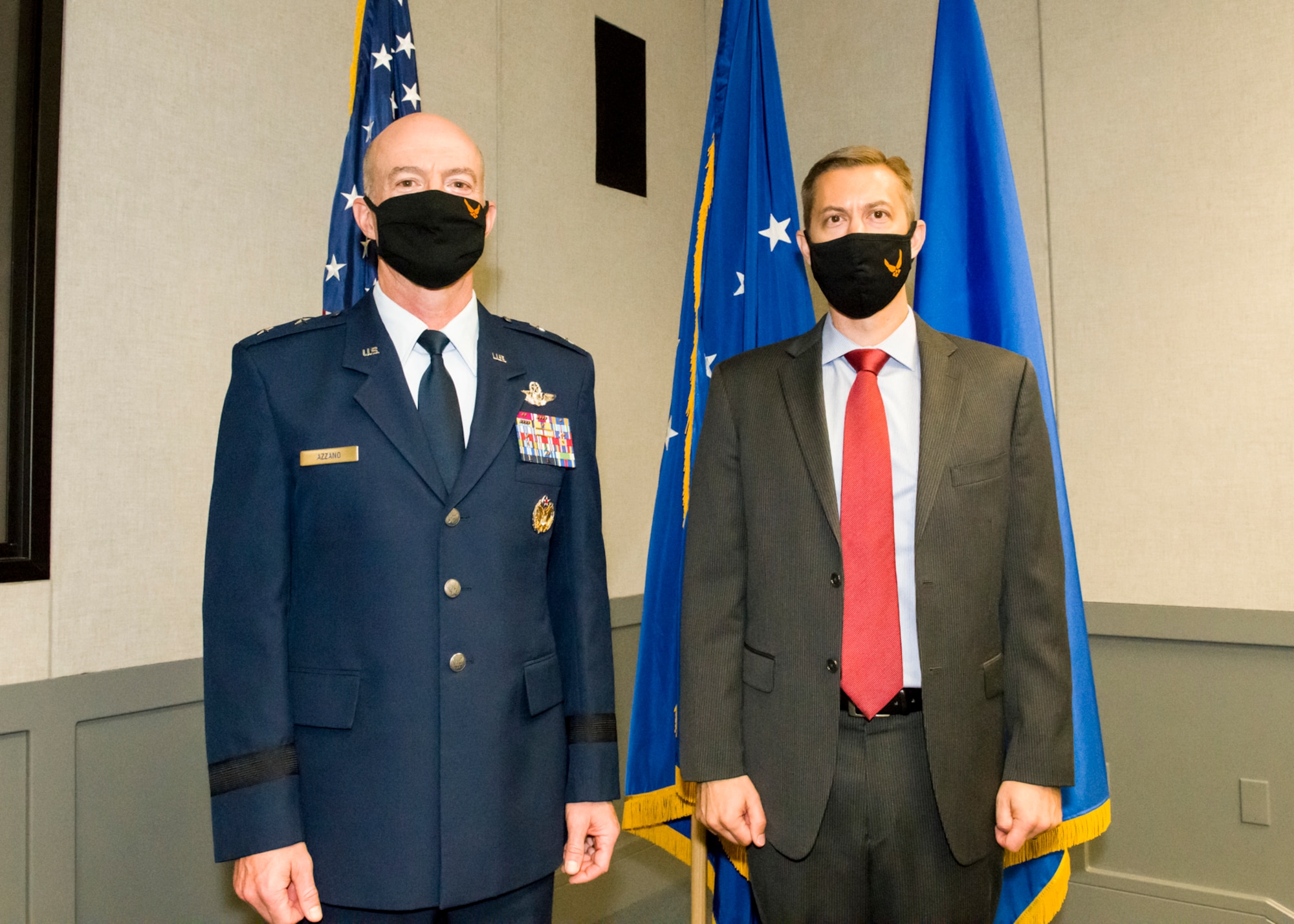 Air Force Test Center Commander, Maj. Gen. Christopher Azzano, stands next to Christopher Klug, the new Multi-Domain Test Force Detachment 1 director.