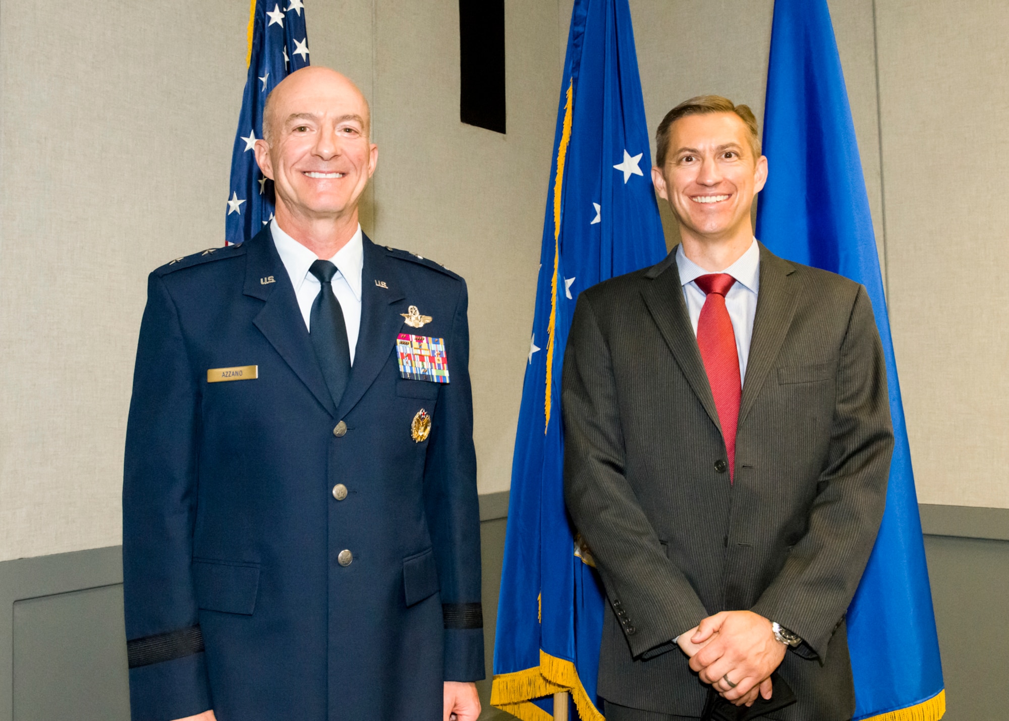 Air Force Test Center Commander, Maj. Gen. Christopher Azzano, stands next to Christopher Klug, the new Multi-Domain Test Force Detachment 1 director.
