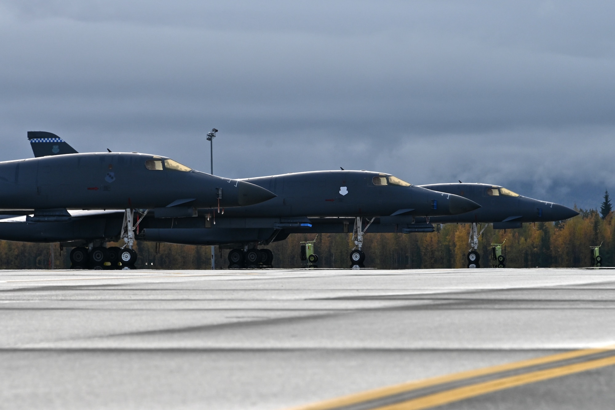 Photo of three B-1 Lancers in line.