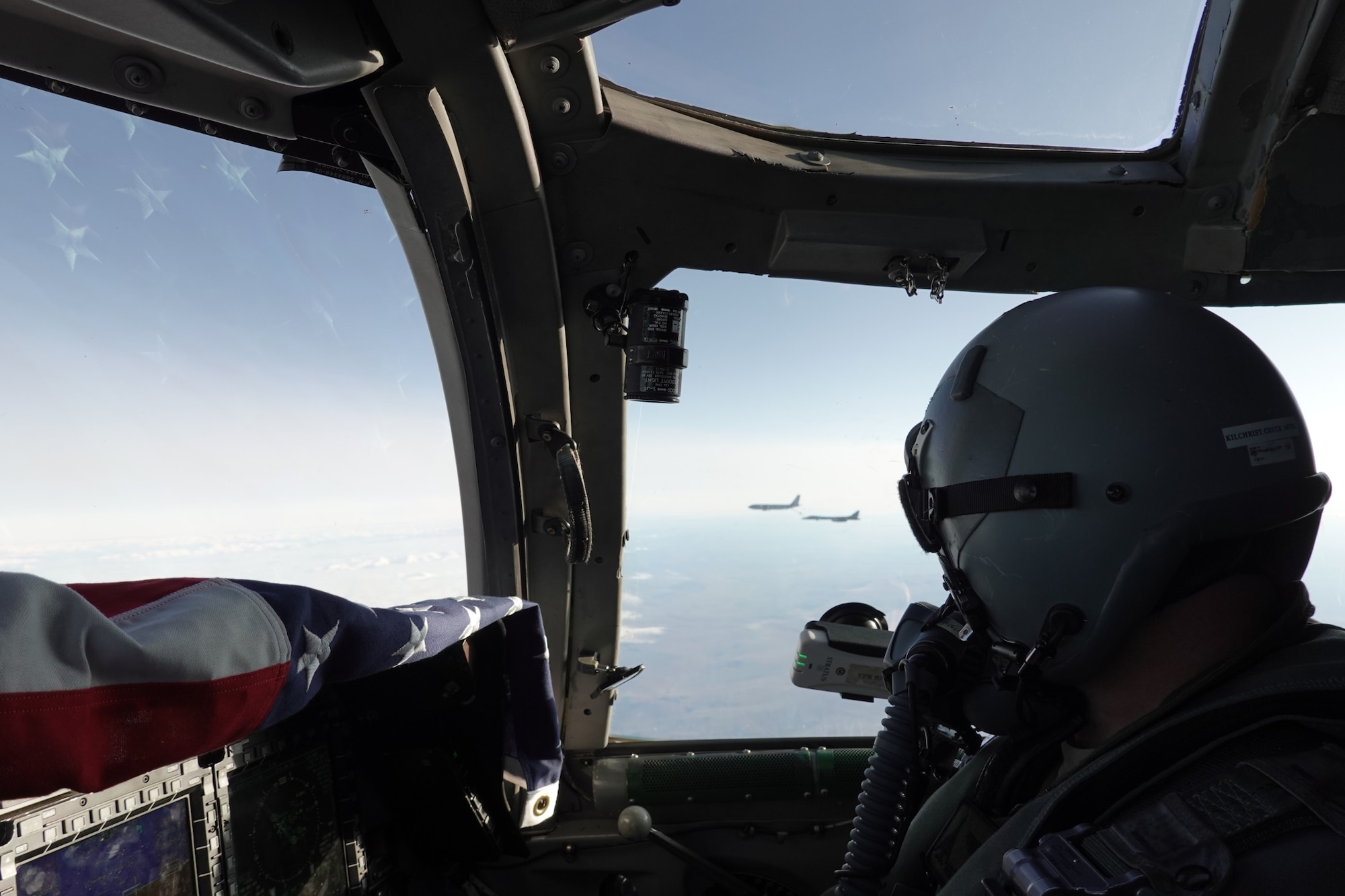 Photo of a B-1 Lancer pilot looking out of window.