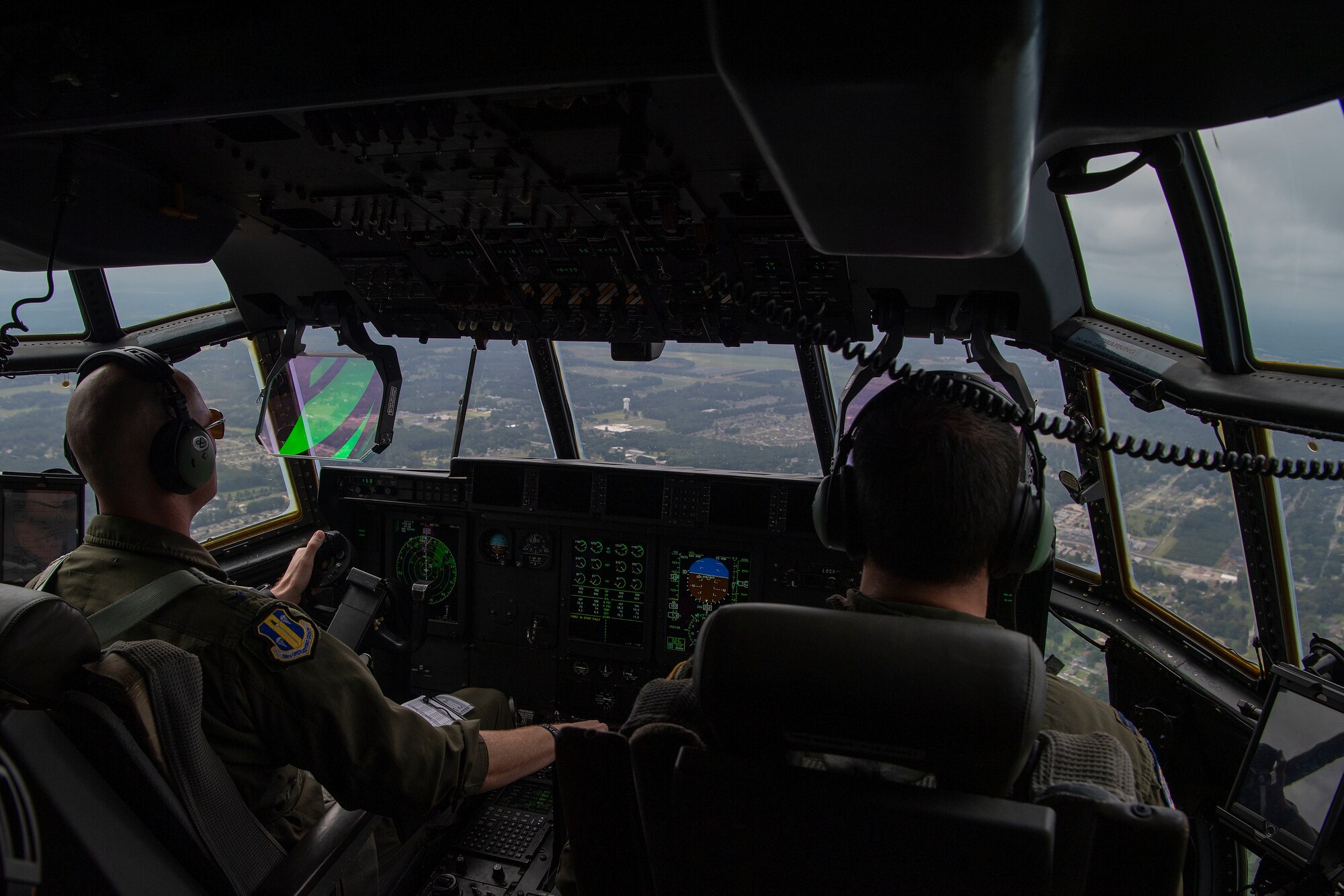 Two pilots fly over Arkansas during a training exercise.