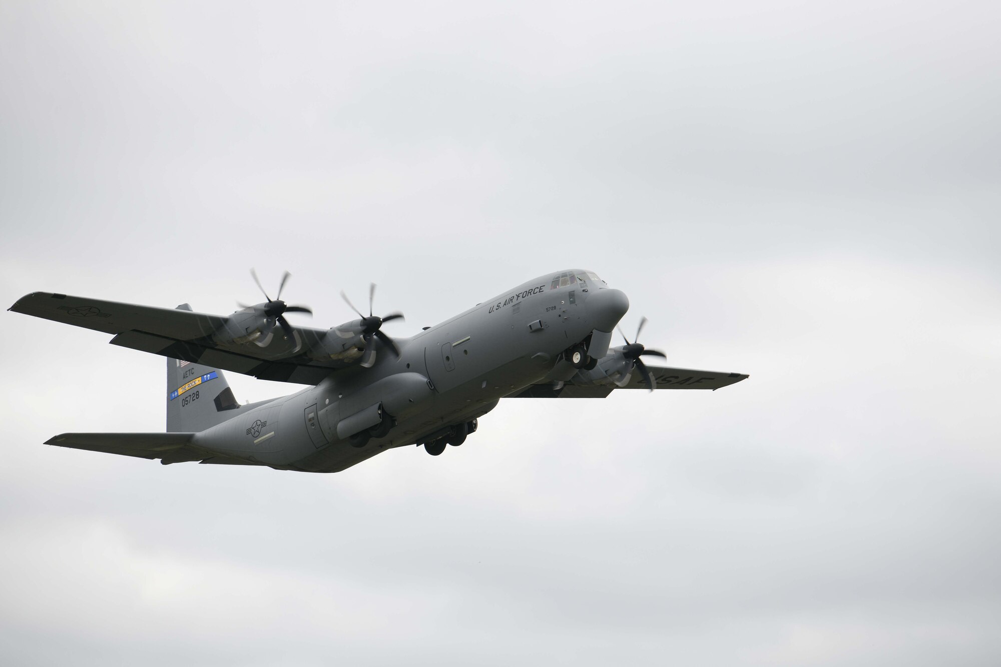 A C-130 takes off from All American drop-zone.