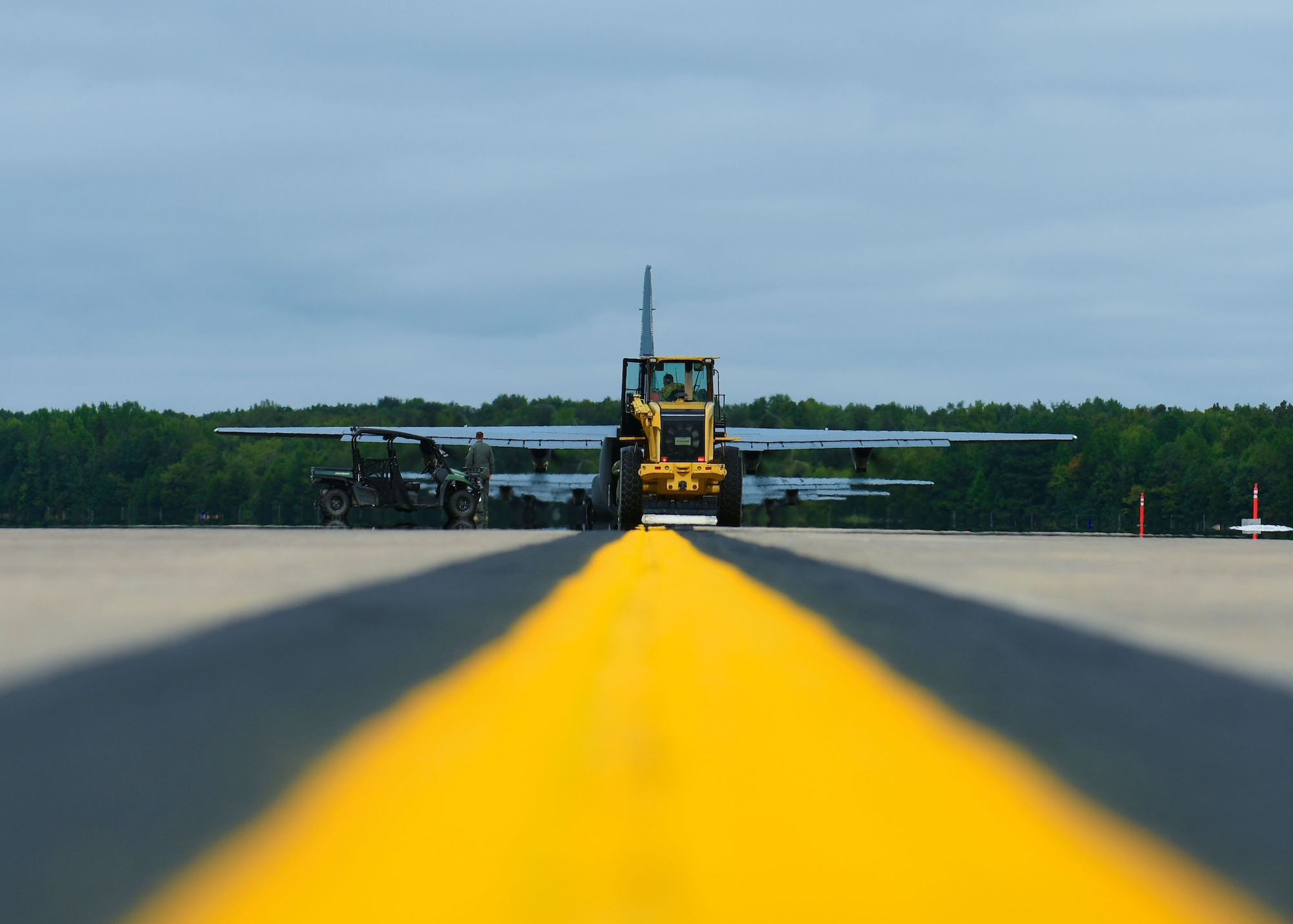 C-130s taxi down the flight line.