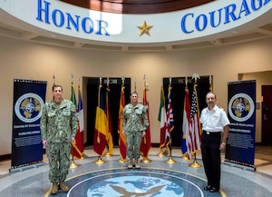 Vice Adm. Dave Kriete, outgoing director, Combined Joint Operations from the Sea Center of Excellence (CJOS COE), left, Vice Adm. Andrew Lewis, oncoming director, CJOS COE, center, and Royal Navy Commodore Thomas Guy, deputy director CJOS COE, participated in a ceremonial photograph in support of the transition of directorship from deputy commander, U.S. Fleet Forces Command to Commander, U.S. 2nd Fleet.