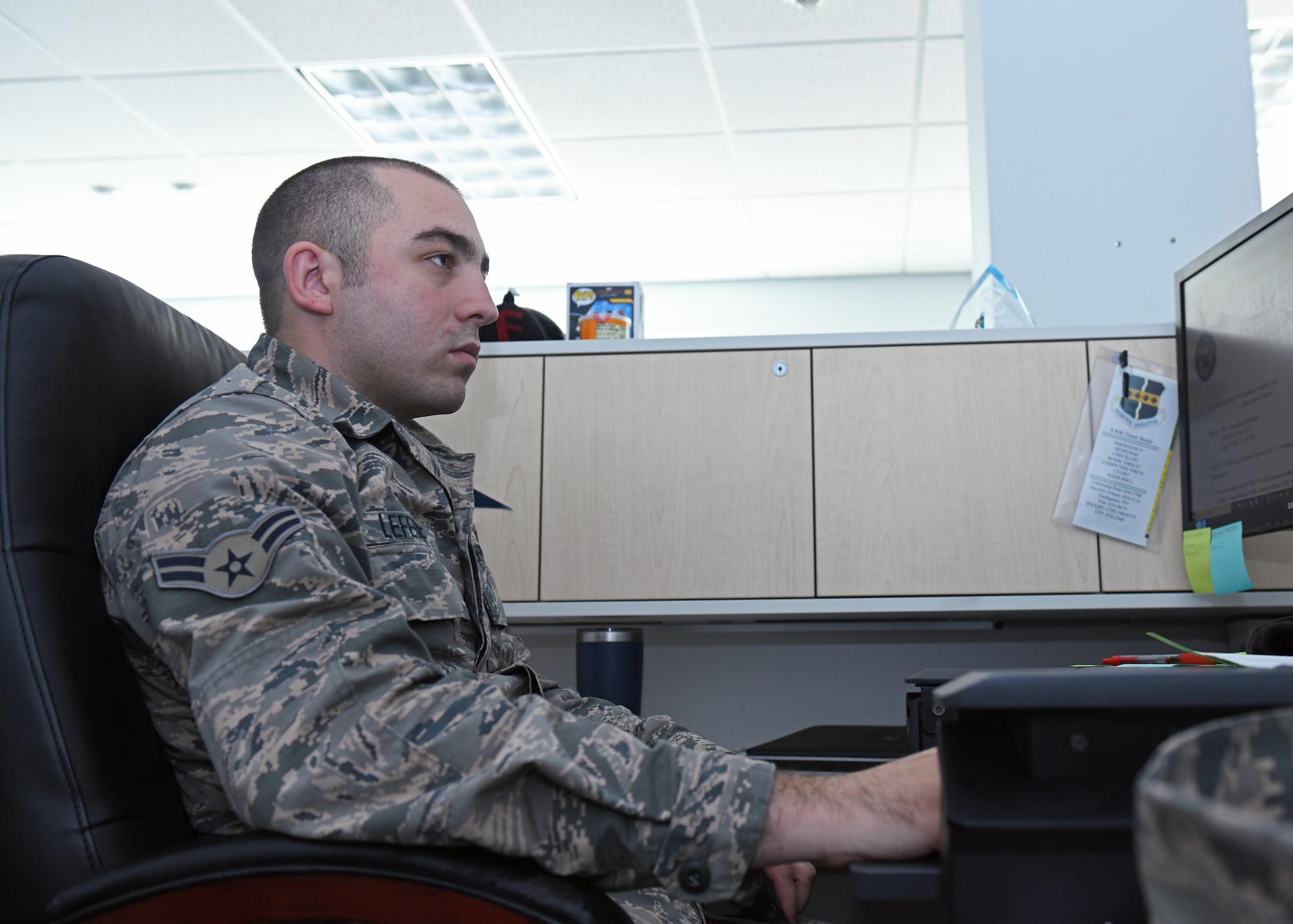 Airman 1st Class Justin Lefevre, 9th Contracting Squadron contract specialist, works on his computer Sep. 23, 2020 at Beale Air Force Base, California. Contract specialists help prepare, negotiate and award contracts to qualified vendors. (U.S. Air Force photo by Airman 1st Class Luis A. Ruiz-Vazquez)