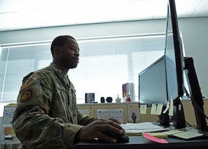 2nd Lt. Cameron Newton, 9th Contracting Squadron Officer in Charge of the services and commodities flight, works on his computer Sep. 23, 2020 at Beale Air Force Base, California. (U.S. Air Force photo by Airman 1st Class Luis A. Ruiz-Vazquez)