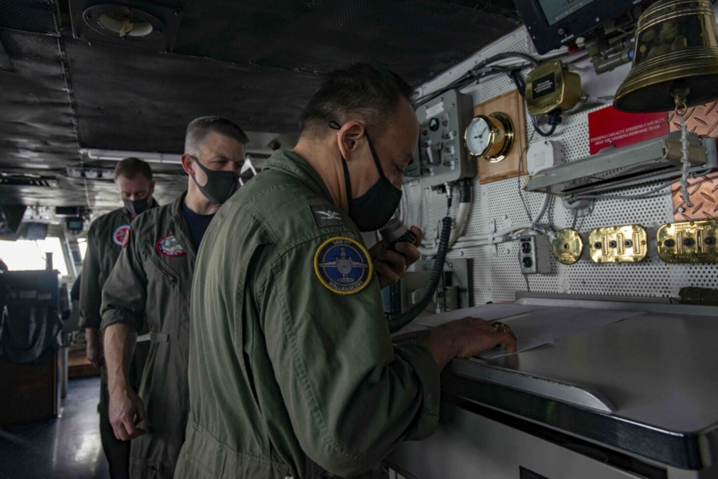 PHILIPPINE SEA (Oct. 1, 2020) Capt. Fred Goldhammer, prospective commanding officer, addresses the crew of the Navy’s only forward-deployed aircraft carrier USS Ronald Reagan (CVN 76) during a change-of-command ceremony in the pilot house. Ronald Reagan, the flagship of Carrier Strike Group 5, provides a combat-ready force that protects and defends the United States, as well as the collective maritime interests of its allies and partners in the Indo-Pacific region