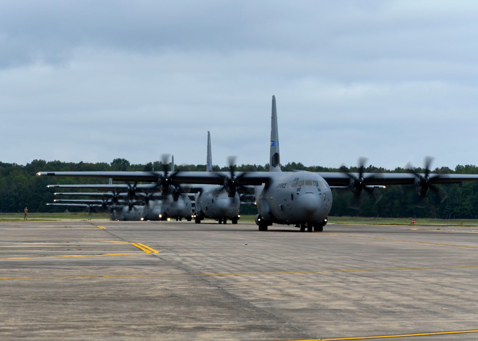 C-130s taxi down the flight line.