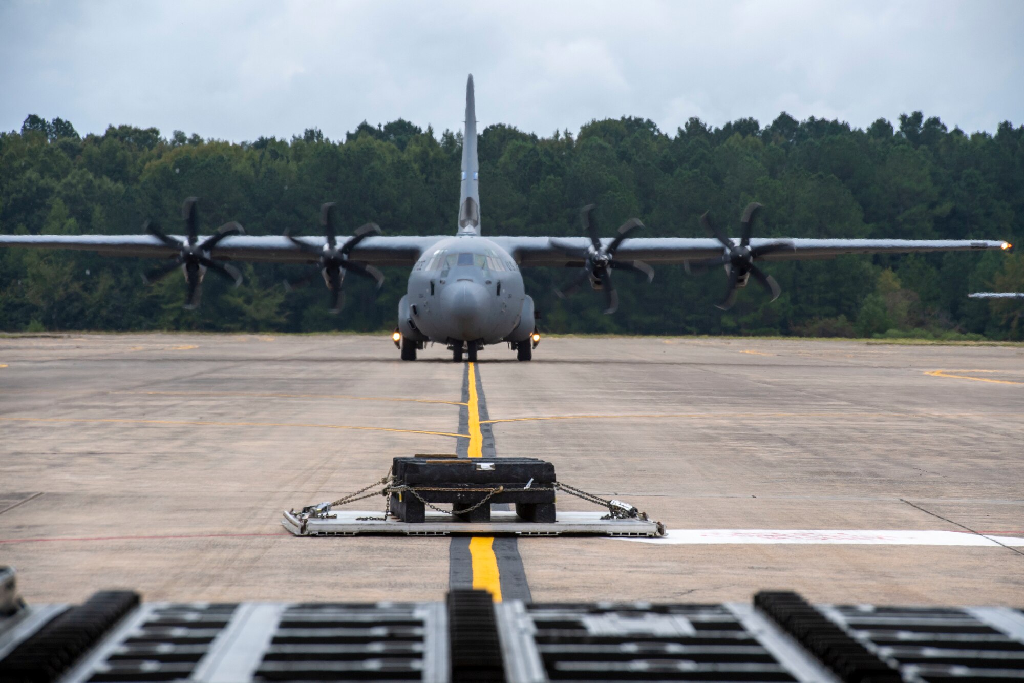 Aircrew from the 314th Airlift Wing conduct a combat offload on the flight line