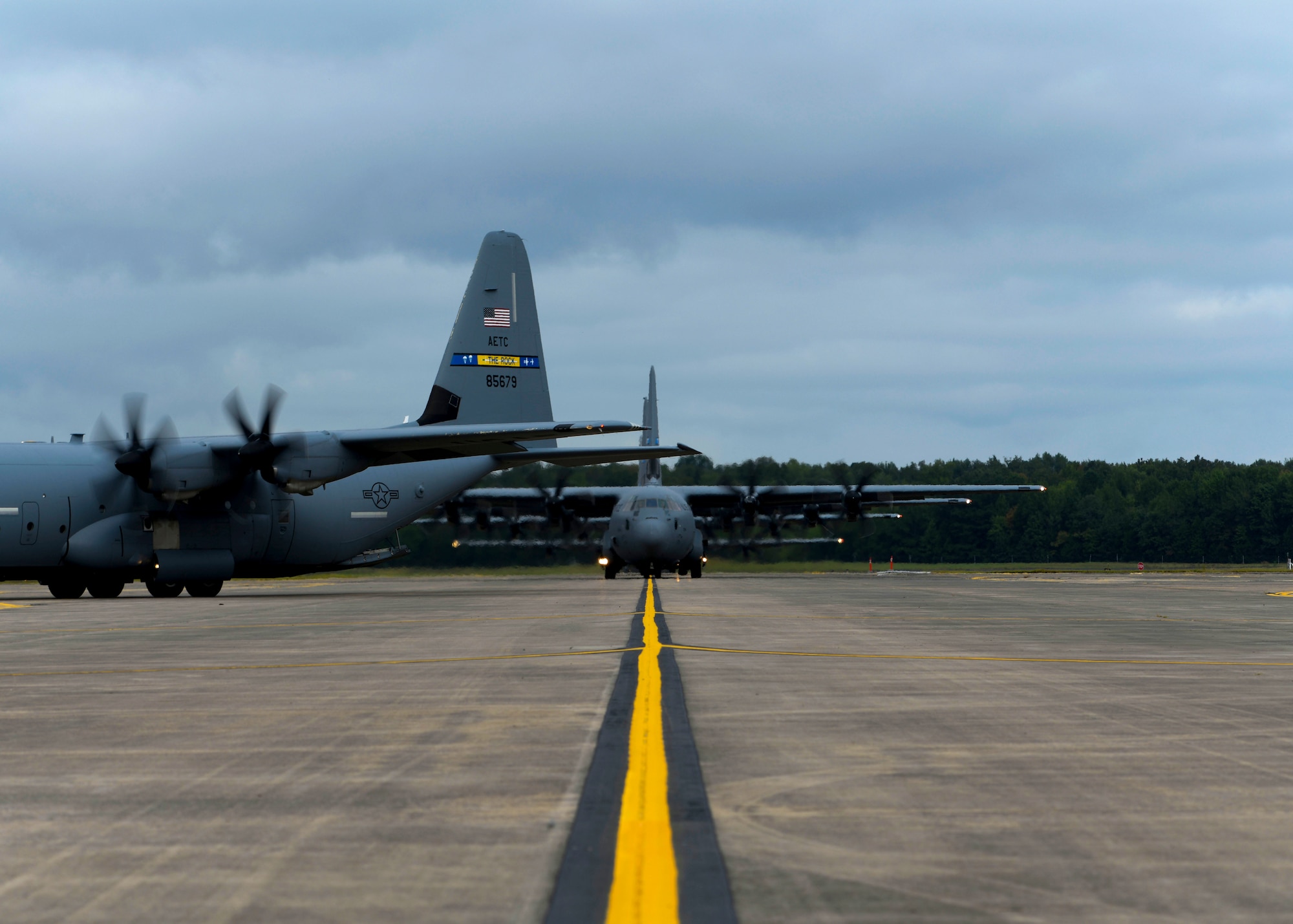 C-130J's taxi down the flight line.