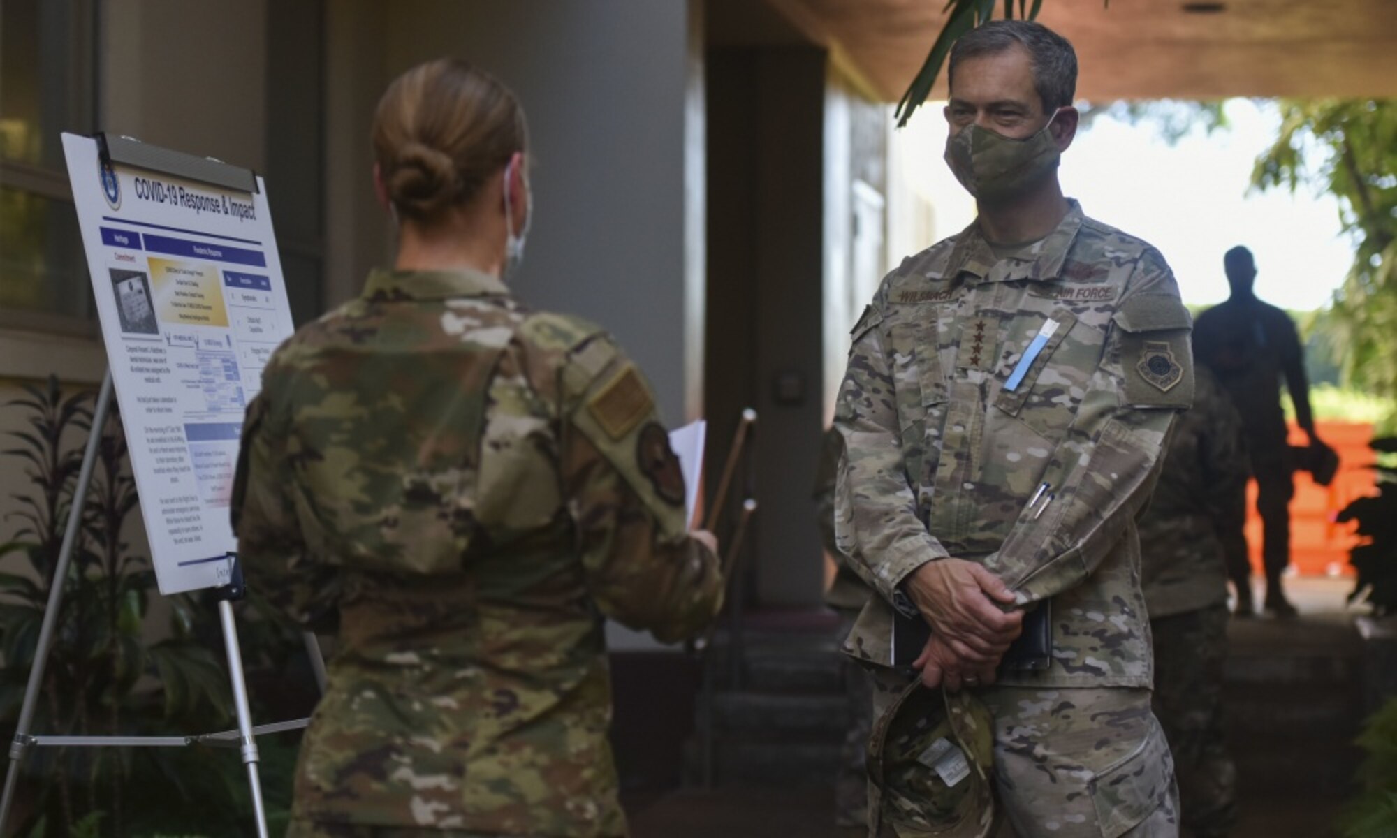 Gen. Ken Wilsbach, Pacific Air Forces commander, listens to a COVID-19 brief from the 15th Wing Medical Group personnel on Joint Base Pearl Harbor-Hickam, Hawaii, Sept. 28, 2020. Wilsbach visited several squadrons around the 15th Wing to gain an in-depth exposure to their unique mission and how the wing contributes to the Indo- Pacific region’s security and stability. (U.S. Air Force photo by Tech. Sgt. Anthony Nelson Jr.)