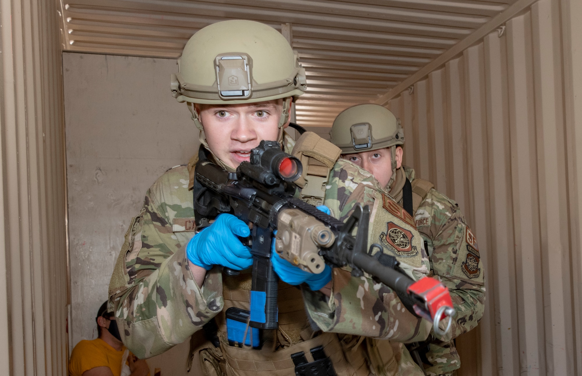 U.S. Air Force Airman Kason Campbell, front, 60th Security Forces Squadron installation patrolman, and Senior Airman Dalton Short, 60th SFS installation patrolman, implement search and room clearing procedures during a base exercise Sept. 24, 2020, at Travis Air Force Base, California. The exercise was designed to evaluate the training, readiness and capability of Travis first responders in order to effectively respond to active shooter threats to the installation. (U.S. Air Force photo by Heide Couch)