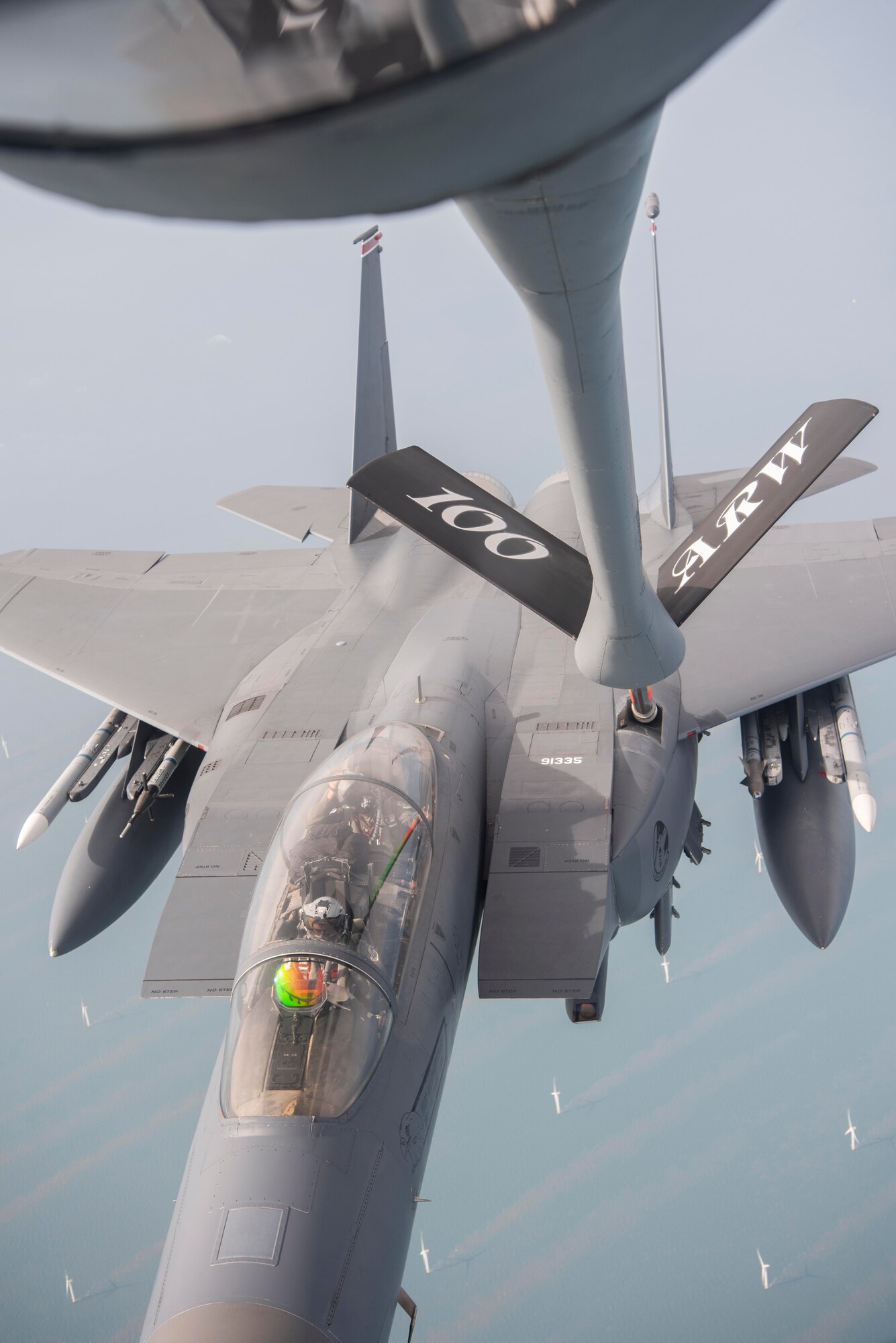 A U.S. Air Force KC-135 Stratotanker aircraft assigned to the 100th Air Refueling Wing, Royal Air Force Mildenhall, England, refuels a U.S. Air Force F-15E Strike Eagle aircraft assigned to the 493rd Fighter Squadron, RAF Lakenheath, England, during Exercise Wolff Pack over the coast of the United Kingdom, Sept. 30, 2020. The exercise tested the 100th ARW’s ability to utilize agile combat employment concepts to support U.S. allied and partner people and assets. (U.S. Air Force photo by Airman 1st Class Joseph Barron)