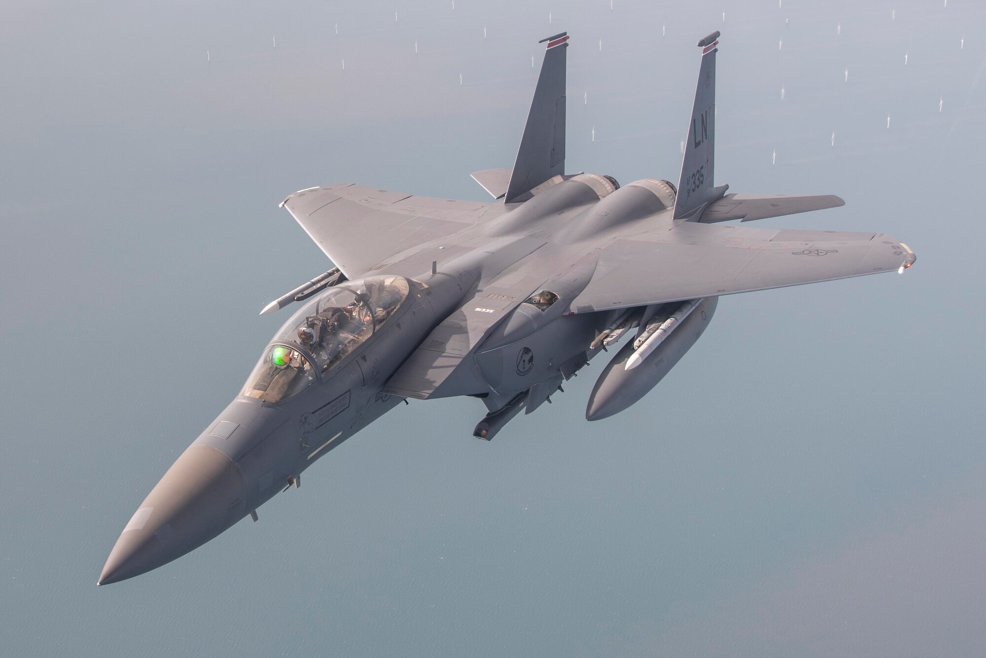 A U.S. Air Force F-15E Strike Eagle aircraft, assigned to the 493rd Fighter Squadron, Royal Air Force Lakenheath, England, peels away after receiving fuel from a U.S. Air Force KC-135 Strato-tanker aircraft, assigned to the 100th Air Refueling Wing, RAF Mildenhall, England, off the coast of the United Kingdom during Exercise Wolff Pack, Sept. 30, 2020. Airmen from the 100th ARW conducted aerial-refueling operations from air bases across Europe, confirming their ability to pro-tect and defend partners, allies and U.S. interests at a moment’s notice. (U.S. Air Force photo by Airman 1st Class Joseph Barron)