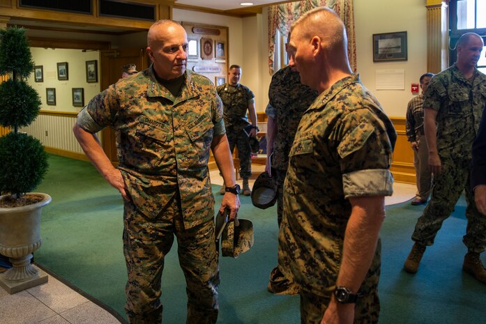 U.S. Marine Corps Maj. Gen. Julian D. Alford, right, commanding general, Marine Corps Installations East-Marine Corps Base Camp Lejeune, speaks with Lt. Gen. Charles G. Chiarotti, left, deputy commandant, Installations and Logistics, on the quarterdeck of Bldg. 1 during his visit to MCB Camp Lejeune, North Carolina, Sept. 30, 2020. Chiarotti and Maj. Gen. Edward D. Banta, commander, Marine Corps Installations Command visited Camp Lejeune and other MCIEAST installations in Eastern North Carolina to receive updates on the progress of hurricane-related construction projects and repairs. (U.S. Marine Corps photo by LCpl. Christian Ayers)
