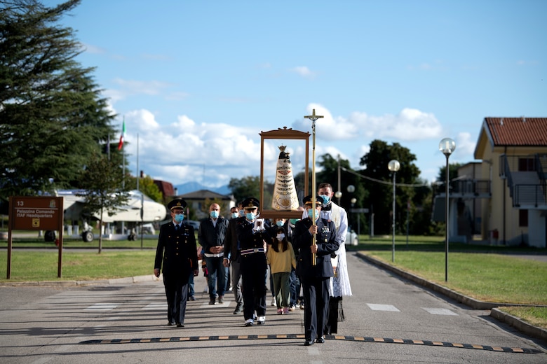 Italian air force members carry a Madonna Di Loreto statue at Aviano Air Base, Italy, Sept. 27, 2020. A special holy mass was held on base to celebrate the Madonna Di Loreto being here. (U.S. Air Force photo by Senior Airman Caleb House)