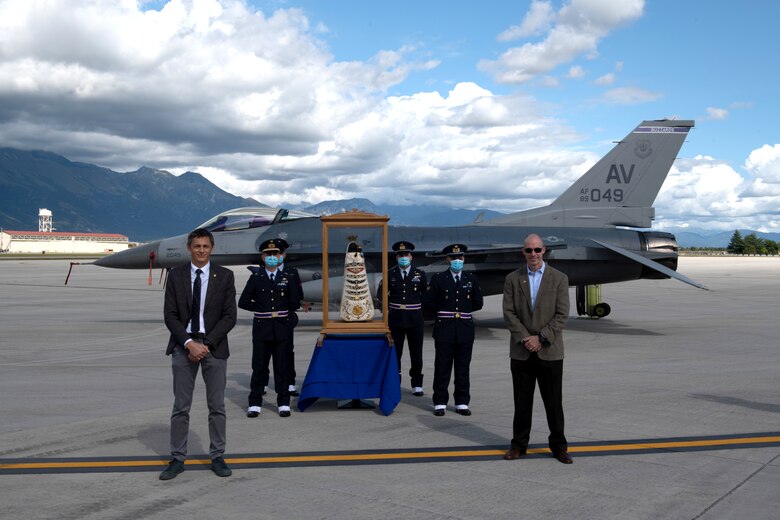 U.S. Air Force Brig. Gen. Jason Bailey, 31st Fighter Wing commander, right, and Italian air force Col. Luca Crovatti, Italian base commander, pose for a photo with a Madonna Di Loreto statue at Aviano Air Base, Italy, Sept. 27, 2020. Madonna Di Loreto was designated as the Patroness of Aeronauts in 1920 by Pope Benedict XV. (U.S. Air Force photo by Senior Airman Caleb House)