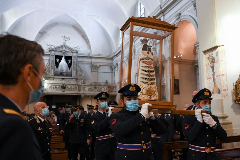 Italian air force members carry a Madonna Di Loreto statue in Pordenone, Italy, Sept. 29, 2020. The Madonna Di Loreto is on a pilgrimage around Italy in celebration of the centenary of her proclamation as the Patroness of Aeronauts. (U.S. Air Force photo by Staff Sgt. Savannah L. Waters)